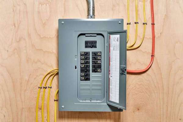 Electrician reviewing a home's electrical load calculations